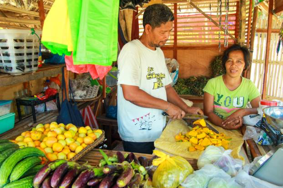 Judith and her husband Freddie in their vegetable stall in the Philippines