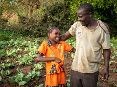 father and his daughter on their farm in Zambia