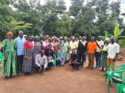 Francis Karugu visiting a FAST savings group in Uganda