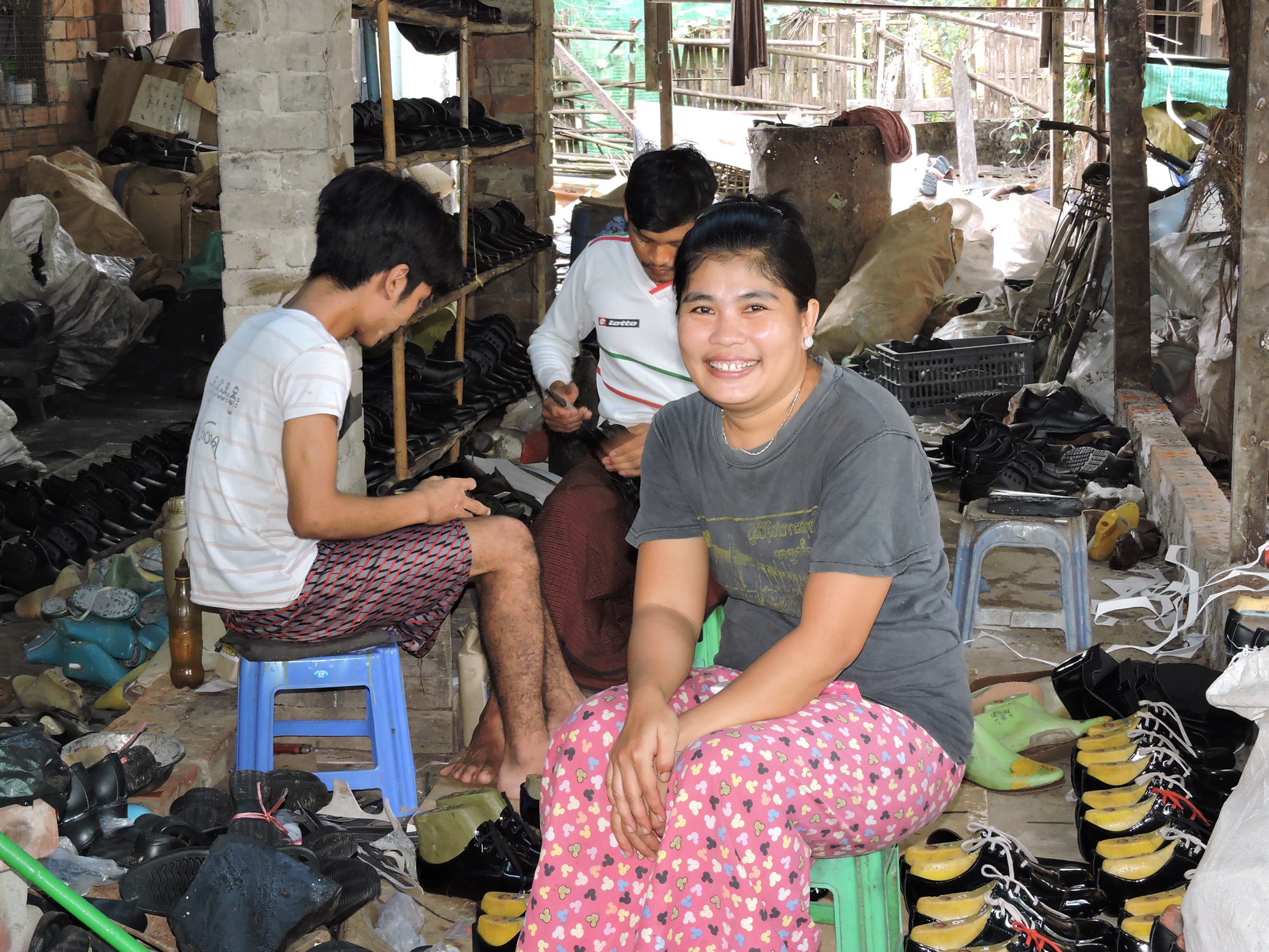 Women with cobblers making shoes