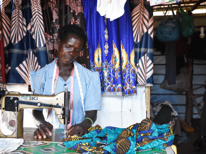 Mary working at her sewing machine