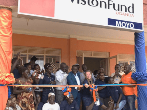 VisionFund Uganda cutting the tape in celebration of new agency opening