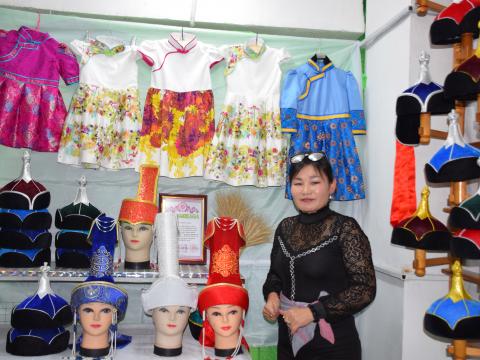 Ankhutya in her hat and clothing shop