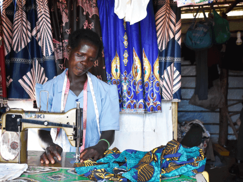 Mary working at her sewing machine