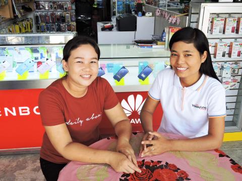 Myanmar staff with small business owner
