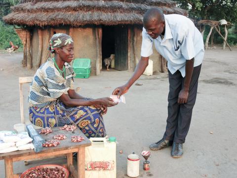 Uganda client receiving money from a customer