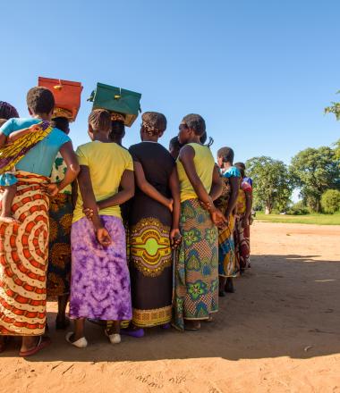 Savings group of women in circle in Zambia