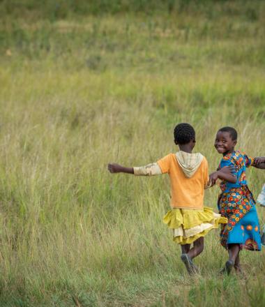 Girls running in rural Zambia