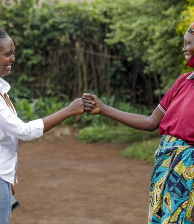 VisionFund Rwanda loan officer greeting client