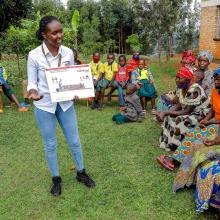 VisionFund Rwanda loan officer providing Embedded Education training to savings group members